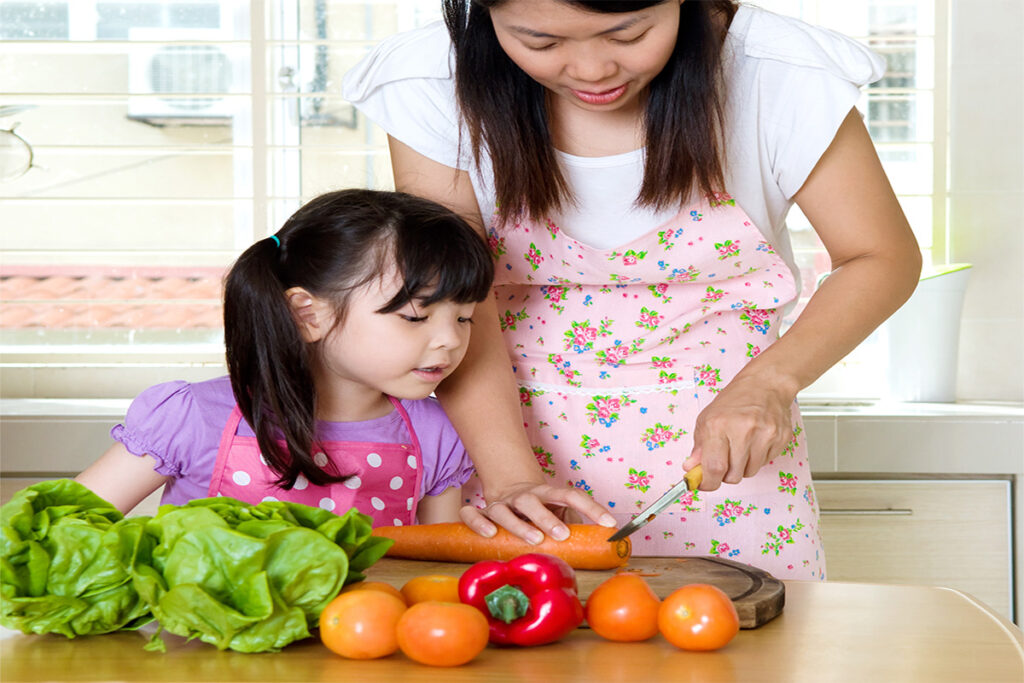 Mom teach Daughter to cook veggies