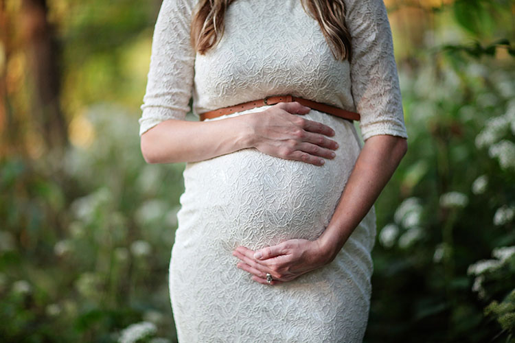Pregnant Woman Holding Tummy
